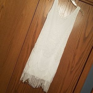 Elegant white flapper dress.